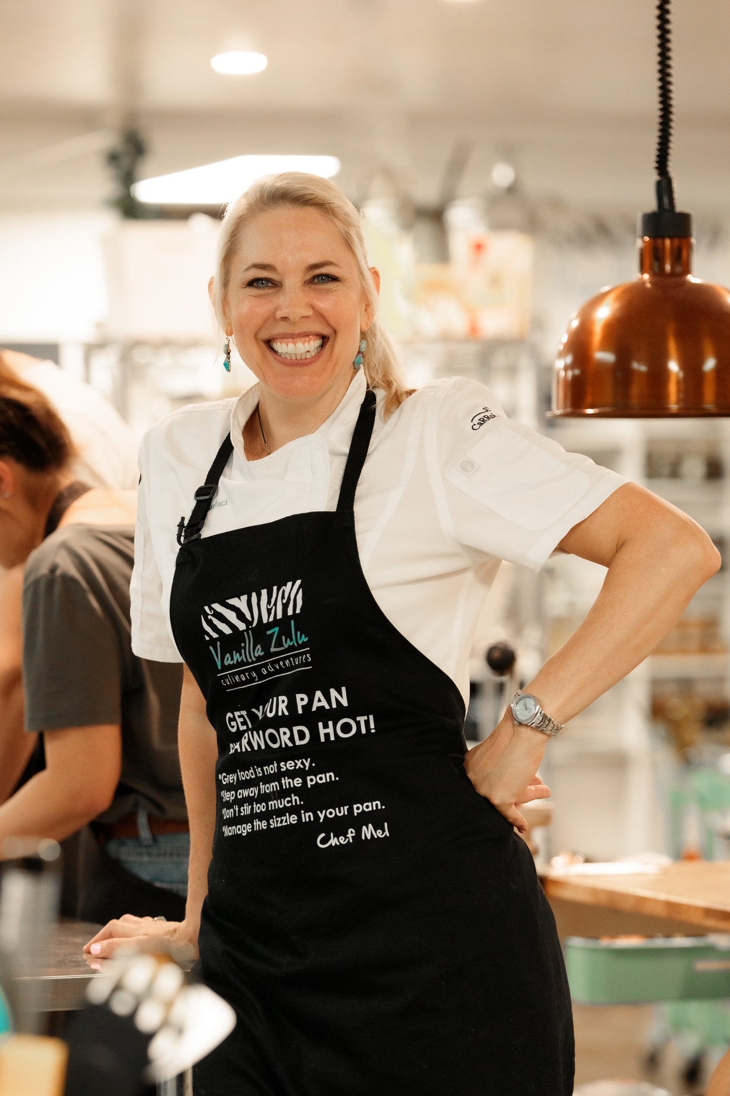 Chef Mel Cooking in apron cooking coach